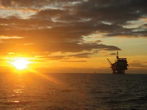 Sun setting on an offshore platform in the UK portion of the North Sea.