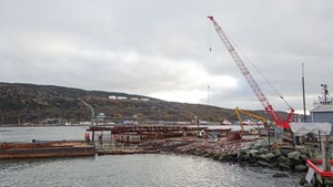 Fig. 10. Construction crews build two new berths in St. John’s harbor for A. Harvey &amp; Company during October 2016. Photo by the author.