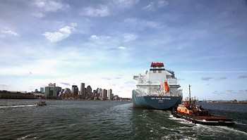 Tugboats escort the GDF Suez Neptune SRV on its inaugural voyage into the Boston Harbor in January 2010. The vessel services the offshore Neptune LNG regasification terminal and the associated onshore facility in Everett, Massachusetts. Courtesy of the Center for Liquefied Natural Gas.