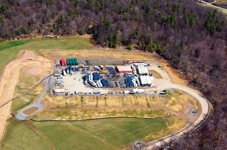 Hydraulic fracturing equipment covers a multi-well pad in Lycoming County, Pennsylvania, where a total of 32 frac stages were pumped in three wells to stimulate production from the Marcellus shale.