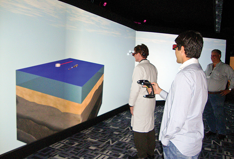 Cenpes engineers use interactive tools to test the capabilities of the facility's immersive 3D simulation room.