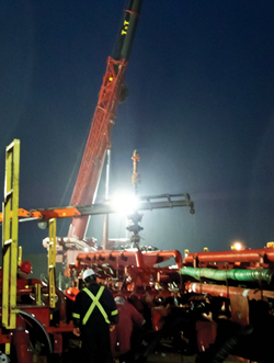 Fig. 5. On a cool, rainy, somewhat surreal Feb. 12 evening, Weatherford and Swift Energy personnel make preparations for a multi-stage frac job on the SMR JV 3H well in AWP field.
