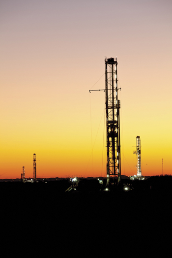 Fig. 5. Four of the 14 rigs drilling for Marathon Oil Corp. Photo courtesy of Marathon Oil Corp.
