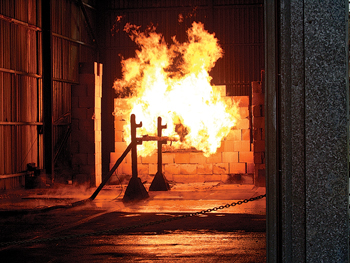 A steel column, after being covered with an intumescent coating, undergoes a fire test. Image courtesy of Sherwin-Williams. A steel column, after being covered with an intumescent coating, undergoes a fire test. Image courtesy of Sherwin-Williams.
