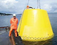 Fig. 4. The first SWIT unit was deployed in July 2009. It could handle 7,500–15,000 bpd of seawater. It contained a still room structure, an electrochlorinator, a hydroxyl radical generator and control equipment, all covered with a trawler cage. 