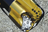 Fig. 1. Baker Hughes hybrid drill bits combine roller cones and PDC fixed cutters into a single design with the rock-crushing strength and stability of roller cones and the continuous shearing action of PDC. Fig. 1. Baker Hughes hybrid drill bits combine roller cones and PDC fixed cutters into a single design with the rock-crushing strength and stability of roller cones and the continuous shearing action of PDC.