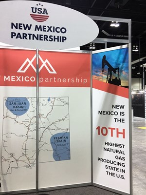 Fig. 2. It would appear that The Energy Transition Act—signed into law by New Mexico Gov. Michelle Lujan Grisham—along with other measures being taken by her administration, would cancel out efforts by the New Mexico Partnership to attract additional oil and gas investment to the state. Yet, just last month, the Partnership had a booth at the Global Petroleum Show in Calgary. Image: Kurt Abraham, editorin- chief.