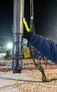 Fig. 3. A LightningPLUS composite plug made up to the wireline adapter kit (WLAK) before being run downhole. The anti-preset features in the plug and the WLAK prevent the tool from pre-stroking during pickup and pre-setting during installation before the plug reaches its planned depth.