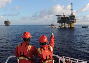CNOOC crew approaching offshore production platform