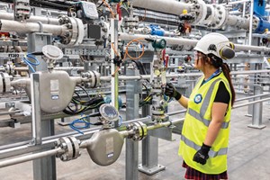 Fig. 4. A technician performs flowmeter analysis in the laboratory.