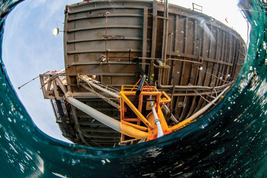Fig. 3. In a traditional decommissioning, a platform’s topsides, jacket and any drilling infrastructure must be disconnected and removed, and then towed to shore for disposal or recycling. Image: Caine Delacy.