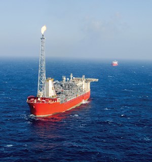Fig. 5. The SeaRose FPSO receives oil produced from White Rose and North Amethyst fields, as well as three subsea tie-backs. A shuttle tanker can be seen in the background. Photo: Husky Energy.