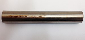 Fig. 1. A section of the stainless steel tubing from the 17-year-old dynamic umbilical. The section on the left shows the state of the tubing prior to cleaning. The section on the right has been cleaned with soap and water.