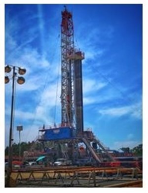 onshore oil rig against blue sky