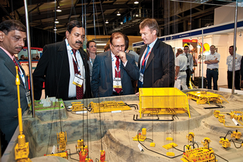Attendees at Offshore Europe 2009 view a model of a subsea field development project.