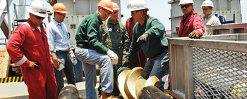 US Interior Secretary Ken Salazar (third from left) inspects a stabilizer on an offshore rig that was used to drill the relief well to contain the Macondo well blowout. Photo by Tami A. Heilemann, courtesy of the US Department of the Interior.
