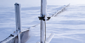 Fig. 1. An experimental snow barrier and monitoring devices with accumulated snow in March 2010. Fig. 1. An experimental snow barrier and monitoring devices with accumulated snow in March 2010.