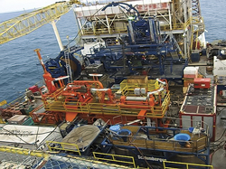 Schlumberger coiled tubing operations taking place aboard a Petronas Carigali production platform. Schlumberger coiled tubing operations taking place aboard a Petronas Carigali production platform.
