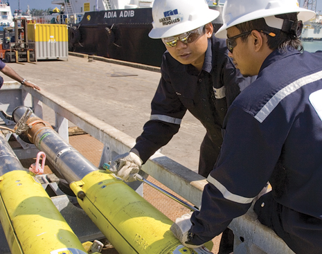 Baker Hughes technicians prepare to deploy the MagTrak logging-while-drilling magnetic resonance service to acquire real-time data to locate and identify producible fluids. Baker Hughes technicians prepare to deploy the MagTrak logging-while-drilling magnetic resonance service to acquire real-time data to locate and identify producible fluids.
