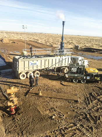Fig. 4. A winterized version of the Supreme Service & Specialty Co. Sand Dehydration Station (SDS), shown here at work in the Permian basin, will move to the Bakken/Three Forks play this year. Note the cloud, which illustrates the effectiveness of the built-in degasser to safely vent entrained gas. Courtesy of Supreme Service & Specialty Co.