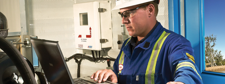 An operator logged onto a dedicated supervisory control and data acquisition (SCADA) system analyzes real-time production data to diagnose problems and implement pump adjustments remotely. 