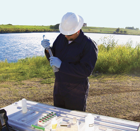 A Baker Hughes employee performs testing for the new Baker Hughes H2prO(tm) water management service that is designed specifically for surface water challenges and provides solutions for technical, economic, and regulatory issues related to oilfield water. Picture courtesy of Baker Hughes.
